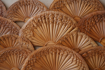 Large fan-shaped bamboo wall hanging, artistic details, natural bamboo texture, tropical decoration style
