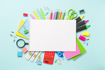 School supplies or office stationery on blue background.
