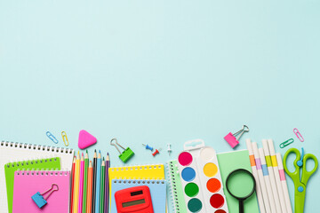 School supplies or office stationery on blue background.