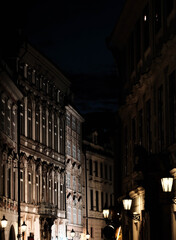 Fototapeta premium a city street in Prague in the Czech Republic at night illuminated by the city's electric lights on an autumn evening