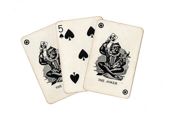A hand of vintage playing cards showing a pair of jokers and one other card on a white background.