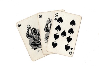 A hand of vintage playing cards showing a pair of jokers and one other card on a white background.