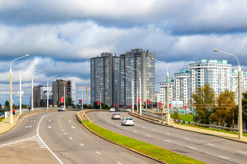 Obraz premium Busy city road street cars traffic people buildings Minsk Belarus.