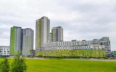 New round green residential area buildings skyscraper in Minsk Belarus.