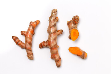 Dry Turmeric powder and turmeric root isolated on white background ,Top view