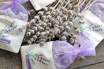 Dried lavender, bunch of dried lavender flowers in lavender bag on rustic table 	