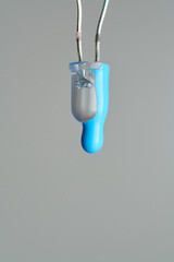 Cyan paint drop falling from led