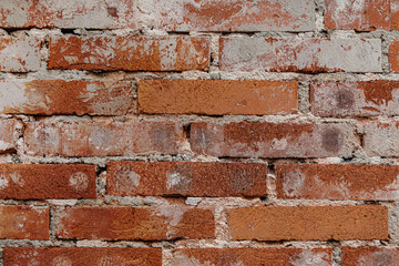 abstract background of an old shabby red brick wall close up