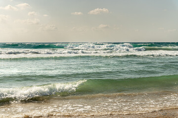 beautiful landscape of wavy sea on a windy cloudy summer day
