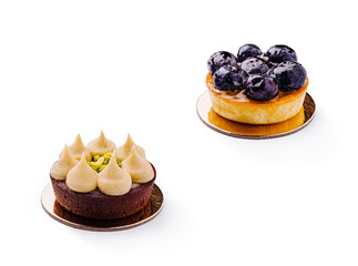 Delicious chocolate and blueberry tarts on a neutral backdrop