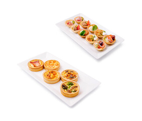 Variety of savory tarts served on rectangular plates at a buffet