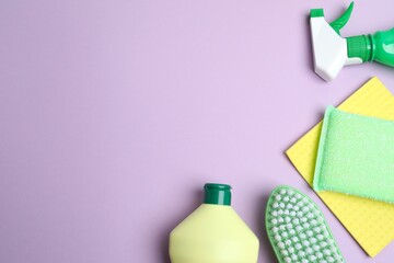 Cleaning products on color background