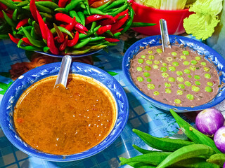 Close-up of chili paste, fermented fish paste, and shrimp chili paste(Nam Prik Kapi, Ngapi yay ) in Burmese restaurants.