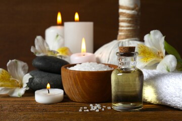 Spa and relaxation concept. Aromatherapy oil with candles in massage room