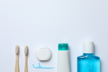 Top view of oral care accessories on white background