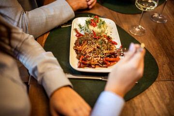 Hands About to Eat Spicy Chicken with Vegetables and Rice