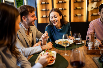 Colleagues Having Fun Sharing Lunch at Restaurant