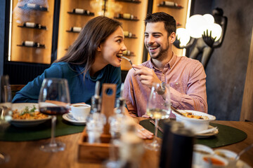 Colleagues Having Fun Sharing Lunch at Restaurant