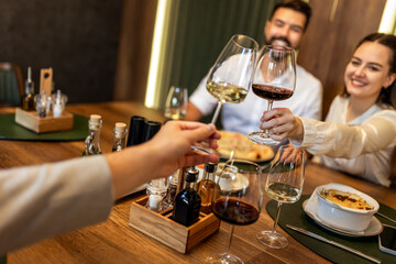 Colleagues Toast with Wine During Lunch at Restaurant