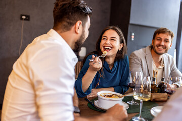 Colleagues Enjoying Lunch with Food and Wine at Restaurant
