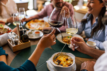 Colleagues Toast with Wine During Lunch at Restaurant