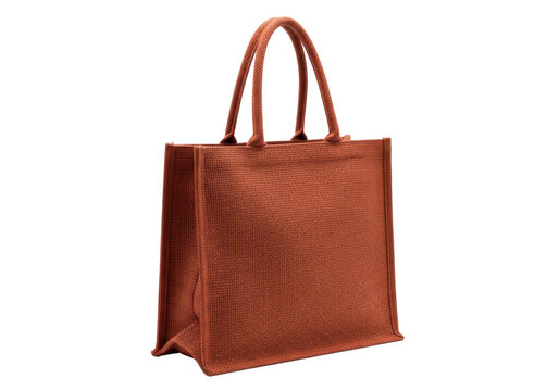 Deep terracotta jute tote bag, robust handles, structured boxy shape, rustic handcrafted texture, isolated on a transparent background with ample copy space. Concept of sustainable design