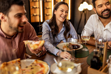 Colleagues Enjoying Lunch with Food and Wine at Restaurant