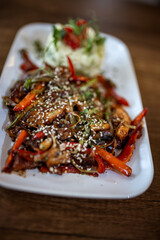 Spicy Chicken with Vegetables and Rice in Restaurant