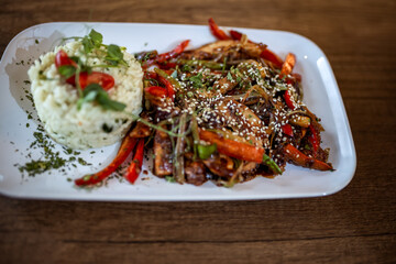 Spicy Chicken with Vegetables and Rice in Restaurant