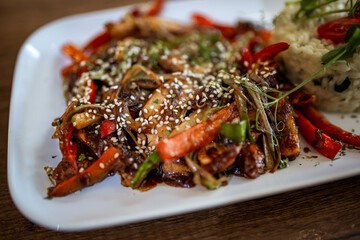 Spicy Chicken with Vegetables and Rice in Restaurant