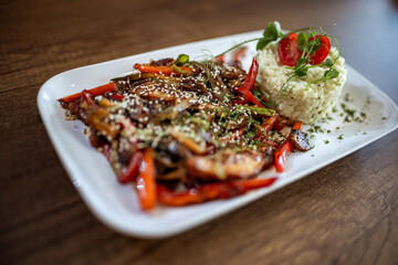 Spicy Chicken with Vegetables and Rice in Restaurant