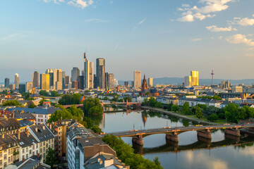 Frankfurt City Skyline, Residential Buildings, Bridges and Main River at Sunrise. Aerial View. Golden Hour. Hesse, Germany