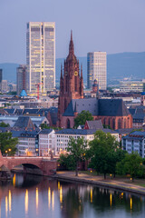 Obraz premium Frankfurt Cathedral, Residential Buildings, Illuminated City and Main River at Morning Twilight. Aerial View. Blue Hour. Hesse, Germany