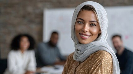 Muslim woman in hijab presenting marketing strategy to diverse team