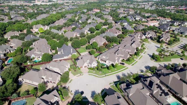Aerial video of houses in a neighborhood in Frisco Texas.