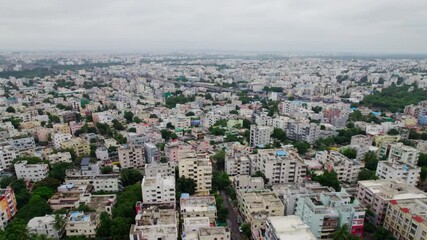 Aerial View of Urban Cityscape with Residential Buildings and Roads. day time, push in, drone shot, 4k.
