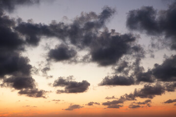 The vibrant blue vanilla hues of the sky are perfectly contrasted by the textured white and shadowy dark clouds.