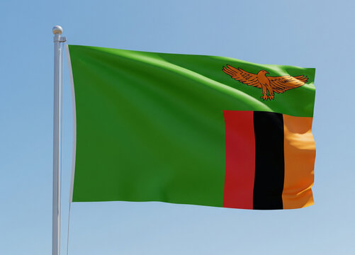 zambia flag waving in blue sky and Happy Independence day