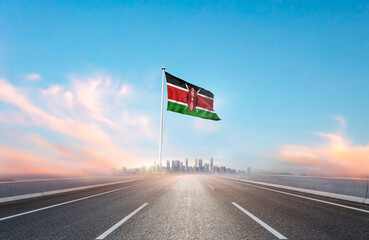 Kenya national flag with mast waving with beautiful skyline. A view from highway. Kenya flag for...