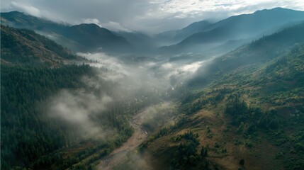 Obraz premium drone shot of mountain valley, morning mist 