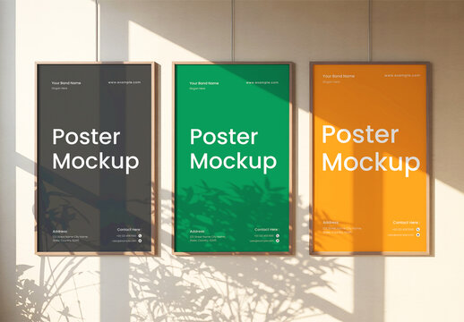Three Vertical Poster Mockups Hanging on Wall