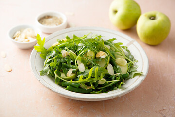 Arugula salad with green apple and almond flakes