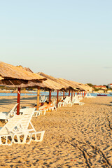 Beach Umbrellas and Loungers at Sunset
