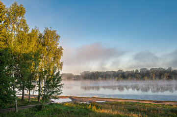 Haze over the river at dawn.	