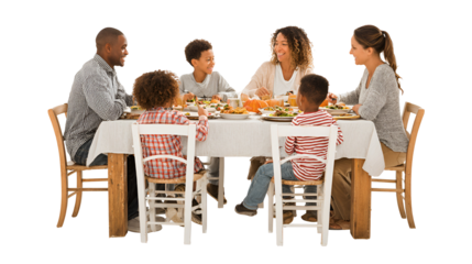 Cheerful multi generational family sharing a holiday meal full of diverse food while seated around the table at home celebrating special occasion together spending quality time