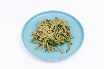 The water in the plate is boiled with Chinese toon sprouts