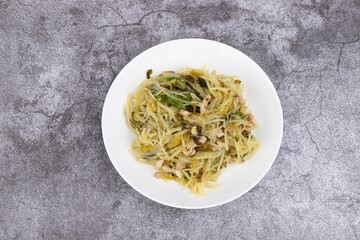 The pickled cabbage, shredded potatoes and stir-fried meat on the plate