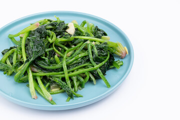 The stir-fried spinach with vegetables on the plate