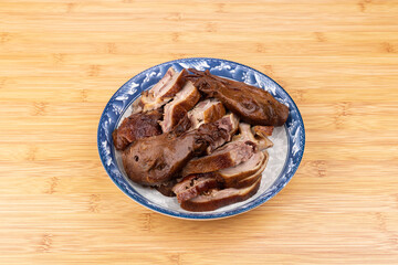 The marinated duck meat on the plate
