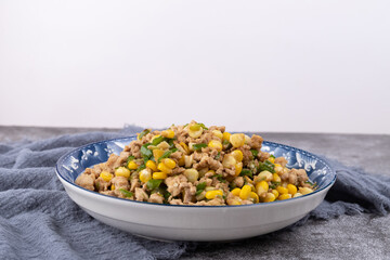 The minced meat stir-fried with corn on the plate